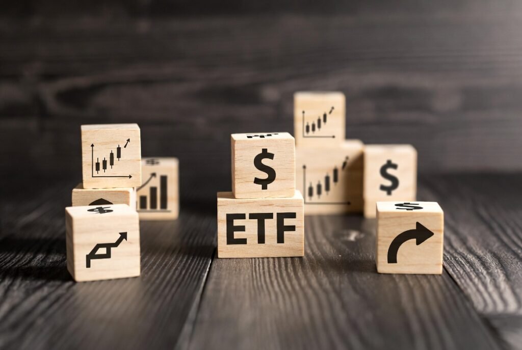 Wooden cube block icon ETF Exchange Traded Fund on table.Business stock market finance Index Fund Concept.